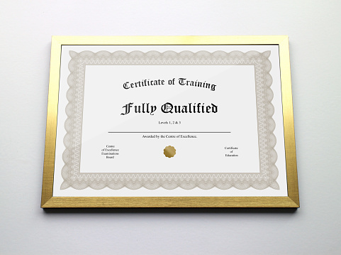 A generic framed certificate award stating 'Fully Qualified'.
