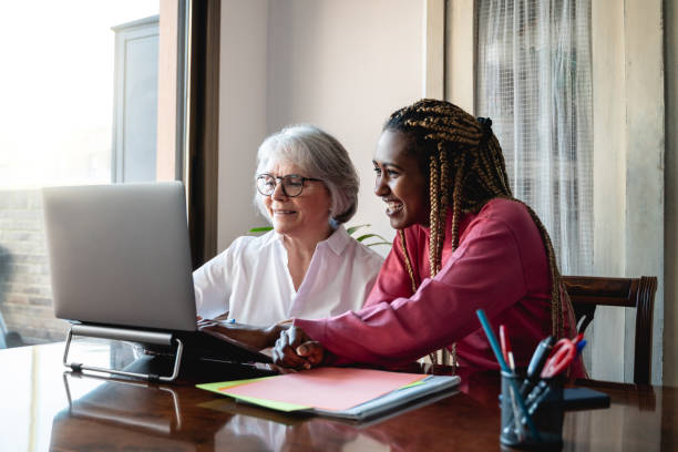 istock Multiracial senior and young business people with working inside modern office - Focus on old woman face 1369326941