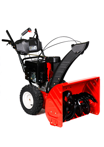 A red snow blower, snow thrower, snow removal equipment isolated on a white background.