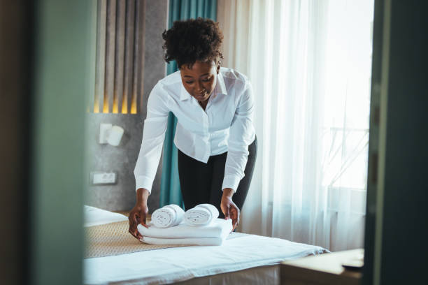 istock Housekeeper cleaning a hotel room. 1369327464