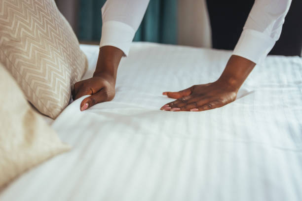 istock Housekeeper cleaning a hotel room. 1369327470