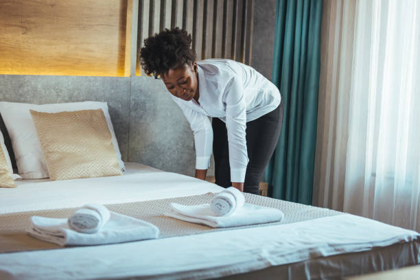 istock Housekeeper cleaning a hotel room. 1369327483