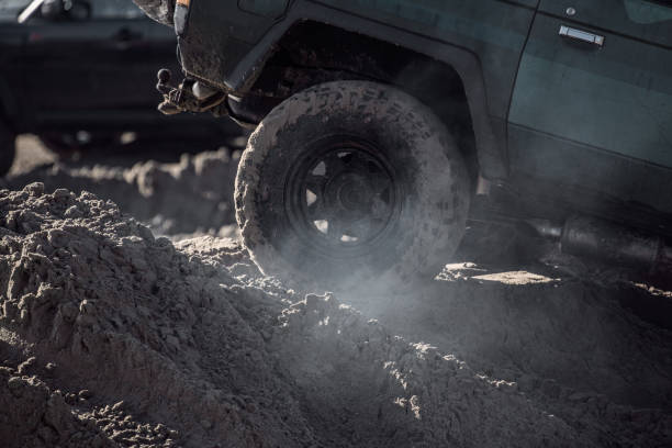 istock Offroad truck and other 4X4 vehicles on a sandy beach 1369330190