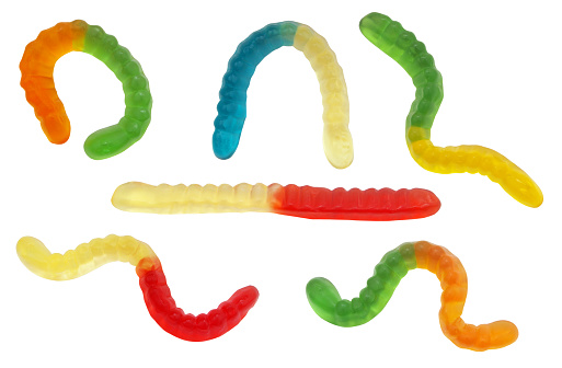 Collection of colorful gummy worms candies isolated on white background