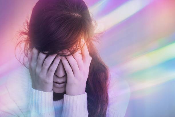 Migraine aura - Portrait of young woman suffering from headache, epilepsy or other problem Migraine aura - Portrait of young woman suffering from headache, epilepsy or other problem aura stock pictures, royalty-free photos & images