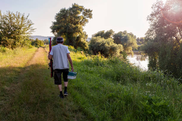 istock Active senior man on fishing 1369334220
