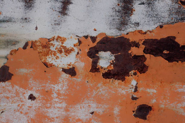 istock Metal texture with peeling paint and scratches which can be used as a background 1369336460