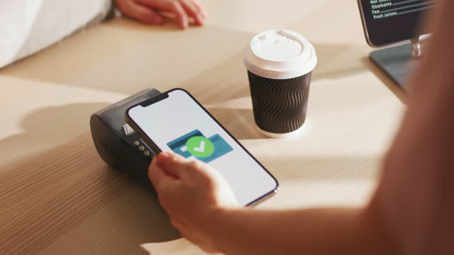 Close-up Paying coffee with contactless payment, Mobile application paying display screen