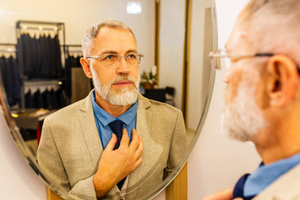 istock well-dressed bearded mature handsome man working in his atelier studio 1369338202
