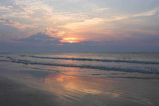 istock sunsets and sunrises are much better when youre by the beach and cliffs. 1369344081