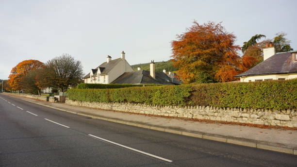 Street view during autumn morning in Drumnadrochit, Scottish Highlands. Drumnadrochit, United Kingdom - 21 OCTOBER 2019 : Street view during autumn morning in the village in Scottish Highlands. drumnadrochit stock pictures, royalty-free photos & images