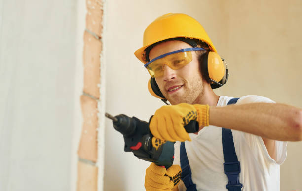 istock With equipment. Young man working in uniform at construction at daytime 1369350155
