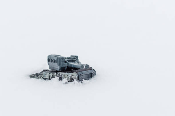 istock Miniature toy war tank on the winter snow.Selective focus,copy space.Outdoors shot. 1369351314