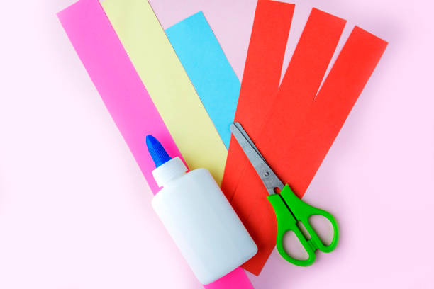 istock Valentines day craft, greeting card. DIY and kid's creativity. Step by step instruction: how to make snail with heart. Step1 preparation tools (glue, colored paper, scissors 1369352372