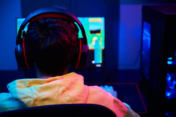 istock Boy plays computer game at home, gaming addiction 1369353156