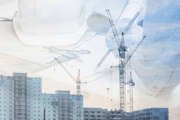 istock Engineer, architect design new buildings on the background of a construction site. 1369355876
