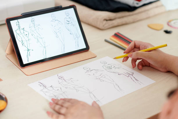 istock Tailor Learning Drawing Fashion Sketches 1369357076