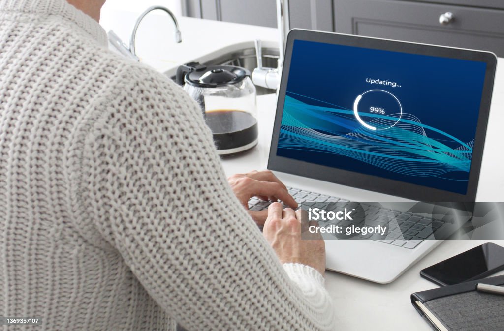 Software Update A laptop loading a fictional software update. Software Update Stock Photo
