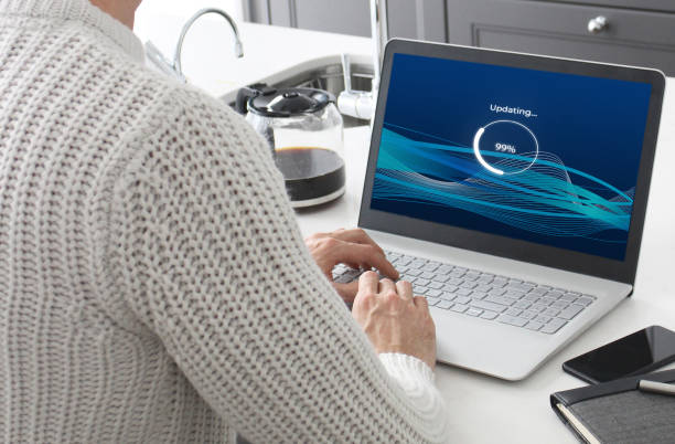 Software Update A laptop loading a fictional software update. debug stock pictures, royalty-free photos & images