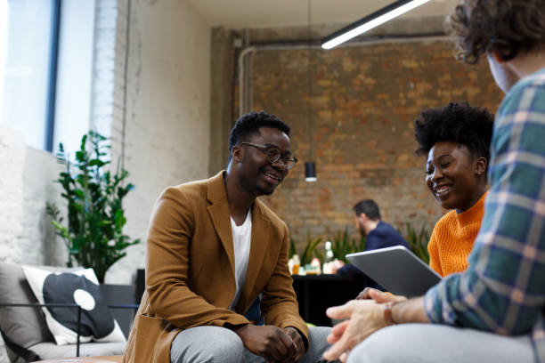 istock Young colleagues are sitting in shared office space. Start-up. 1369357280