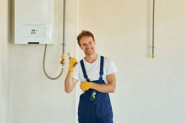 istock Job is done. Young man working in uniform at construction at daytime 1369357539