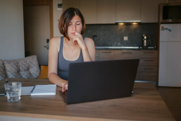 istock young asian woman at home, remote work 1369360130