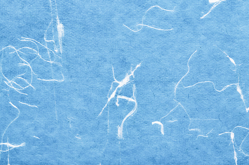 Hand-made art paper with cotton fibers distributed randomly.
