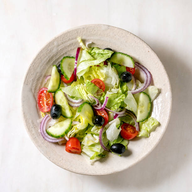 istock Classic vegetable salad with tomatoes, cucumber, onion 1369360517