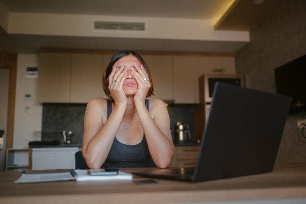 istock young asian woman at home, remote work 1369360598