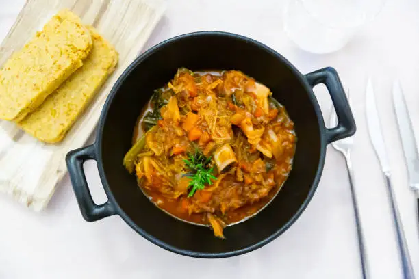 Photo of Popular dish of Lombard cuisine in Italy is Cassoeula with polenta