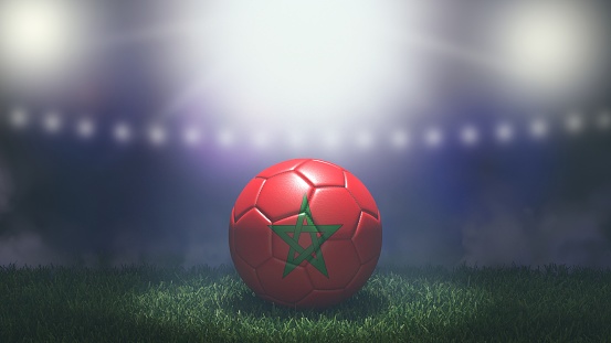 Soccer ball in flag colors on a bright blurred stadium background. Morocco. 3D image