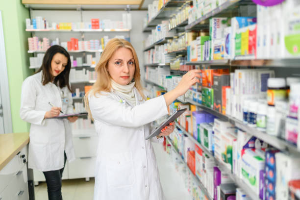 istock Pharmacists at a drugstore 1369365944