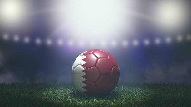 明るいぼやけたスタジアムの背景に旗色のサッカーボール。カタール。 - w杯 ストックフォトと画像