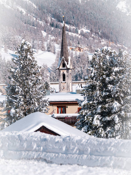bell tower of a church in cinuos chel - engadine switzerland village church imagens e fotografias de stock