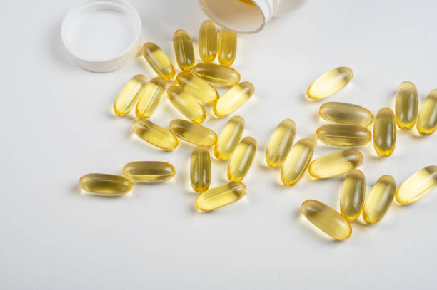istock Gold fish oil isolated on white background 1369367329