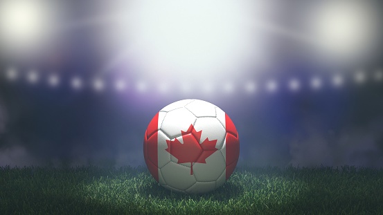 Soccer ball in flag colors on a bright blurred stadium background. Canada. 3D image