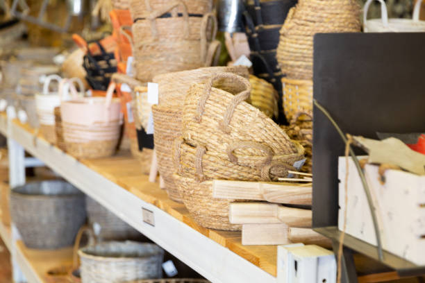 istock Wicker baskets and other handmade items on store shelves close up 1369367830