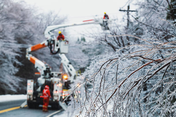 Restoring Power During Ice Storm Linesman work to restore power during an intense ice storm. extreme weather stock pictures, royalty-free photos & images