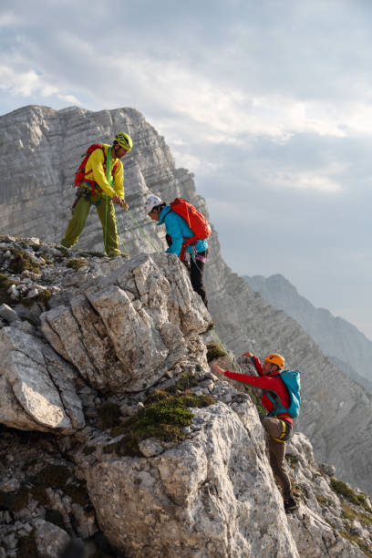 istock Group of mountain climbers on their way to the top 1369376405
