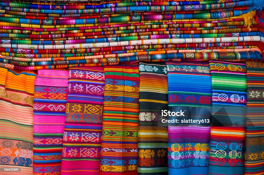 Colorful Navajo Blankets A stack of vibrant Navajo blankets for sale at a stand in Santa Fe, New Mexico Blanket Stock Photo