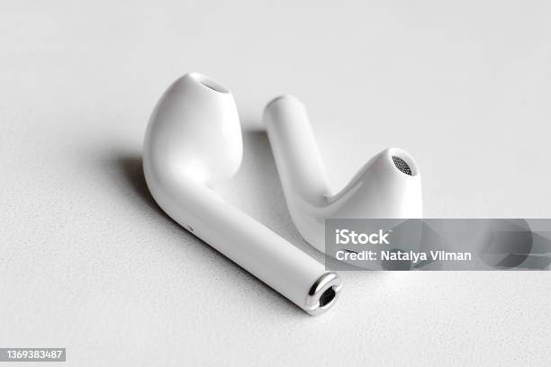 Wireless Headphones On A White Background Closeup The Concept Of Modern Technology Stock Photo - Download Image Now