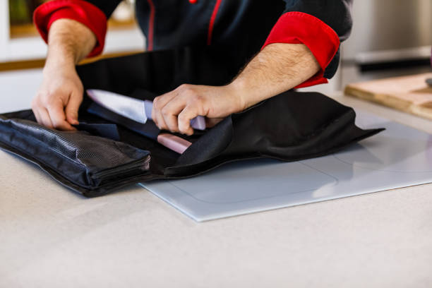 istock Male chef getting a professional kitchen knife from its case 1369383804
