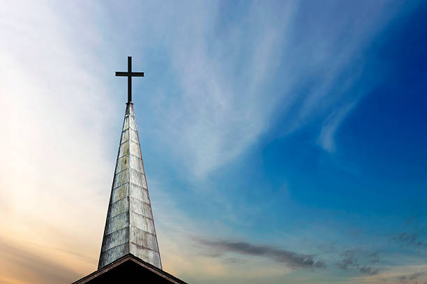 XXL cross and steeple cross and church steeple at dusk (XXL) steeple stock pictures, royalty-free photos & images