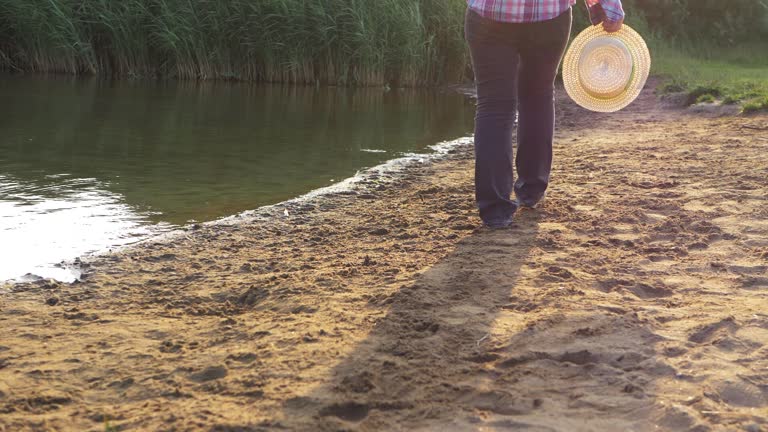 Woman enjoys walking by the lake