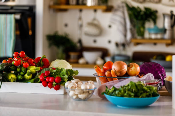 istock Copy space shot of various colorful veggies sitting on a kitchen counter 1369383919