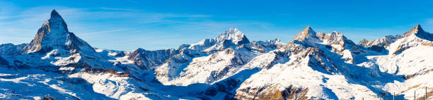 Matterhorn mountain in winter, Valais, Switzerland Panoramic view to the majestic Matterhorn mountain in winter, Valais, Switzerland pennines photos stock pictures, royalty-free photos & images