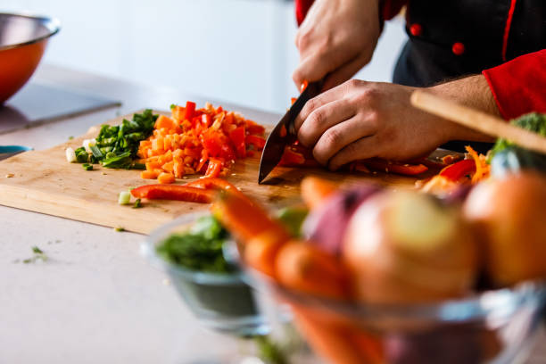 istock Selective focus shot of chef dicing a red bell pepper 1369385826