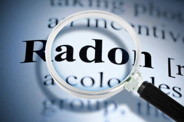 dangerous radon gas text seen through a magnifying glass - radium imagens e fotografias de stock