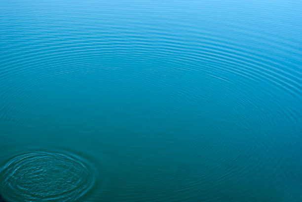 istock greenish water with splash waves, horizontal and area for copy paste 1369389873