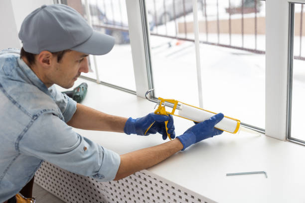 istock The worker installing and checking window in the house 1369389996
